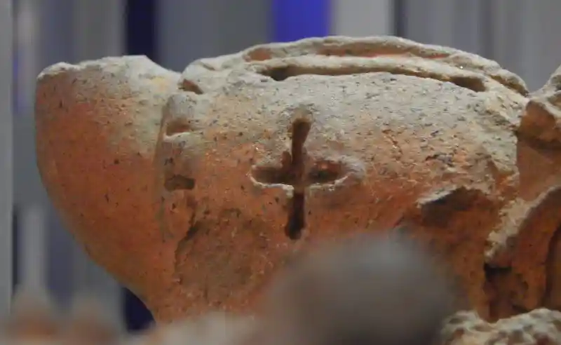 Cross on a clay ritual item